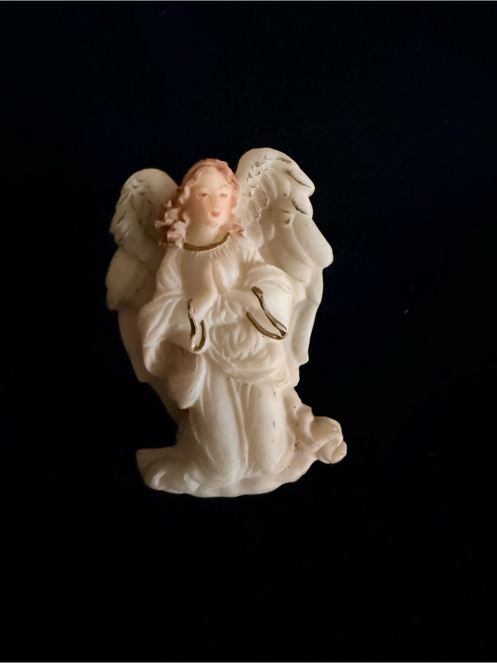 vintage 1994 Roman angel brooch featuring a cream-colored angel gold trim